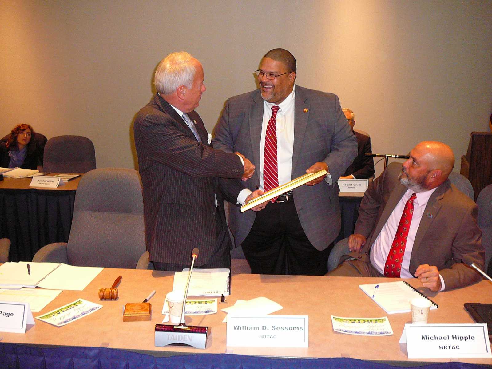 HRTAC Chair William D. Sessoms Jr. Presenting a Resolution of Appreciation to HRTAC Member Kenneth W