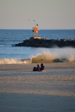 Couple Sitting on the Beach photo